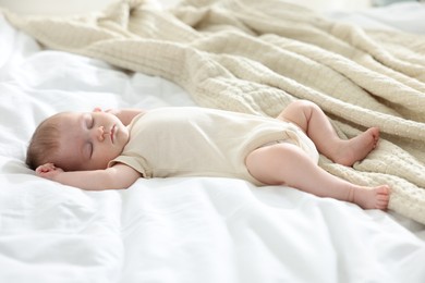 Photo of Cute newborn baby sleeping on bed indoors