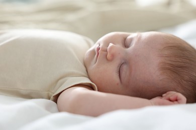Photo of Cute newborn baby sleeping on bed indoors