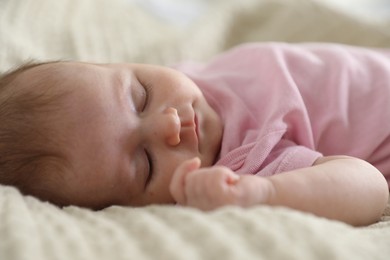 Photo of Cute newborn baby sleeping on bed indoors
