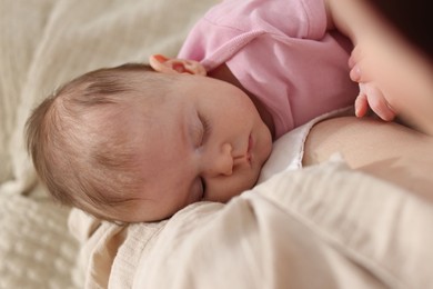 Photo of Mother with her newborn baby indoors, above view