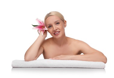 Photo of Beautiful woman with lily flower and towel on white background