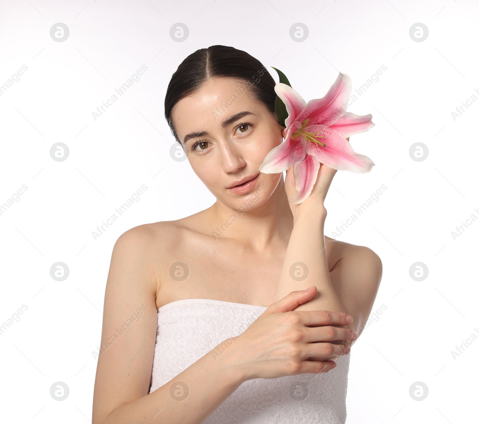 Portrait of beautiful woman with lily flower after spa treatment on white background Photo of Portrait of beautiful woman with lily flower after spa treatment on white background
