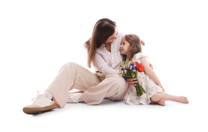 Photo of Mother and her little daughter with bouquet of beautiful flowers on white background