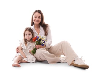 Photo of Mother and her little daughter with bouquet of beautiful flowers on white background