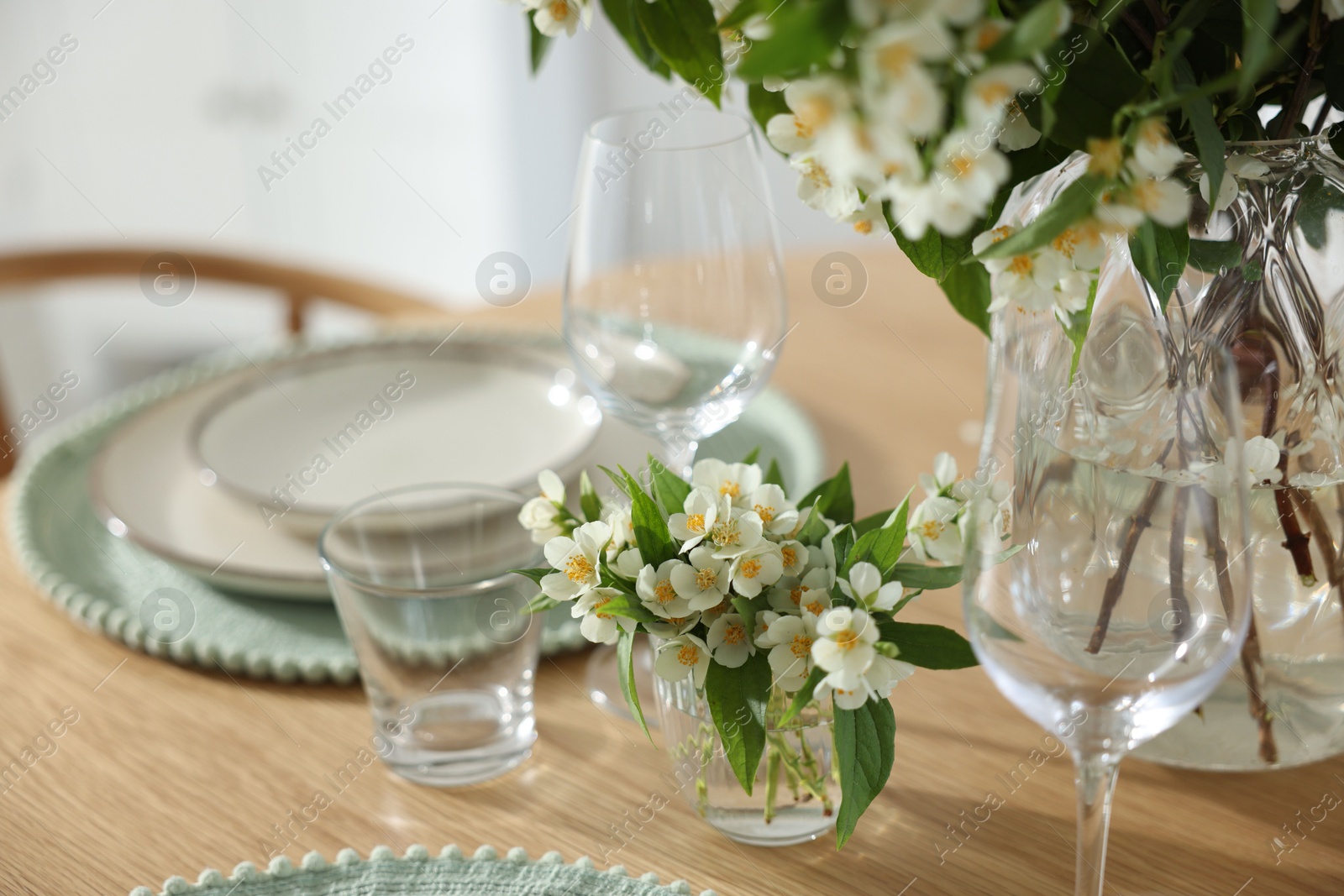 Bouquet of beautiful jasmine flowers on dining table indoors, closeup Photo of Bouquet of beautiful jasmine flowers on dining table indoors, closeup