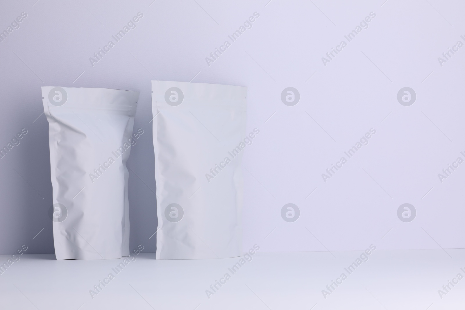 Zipper stand-up pouches on white background. Mockup for design Photo of Zipper stand-up pouches on white background. Mockup for design