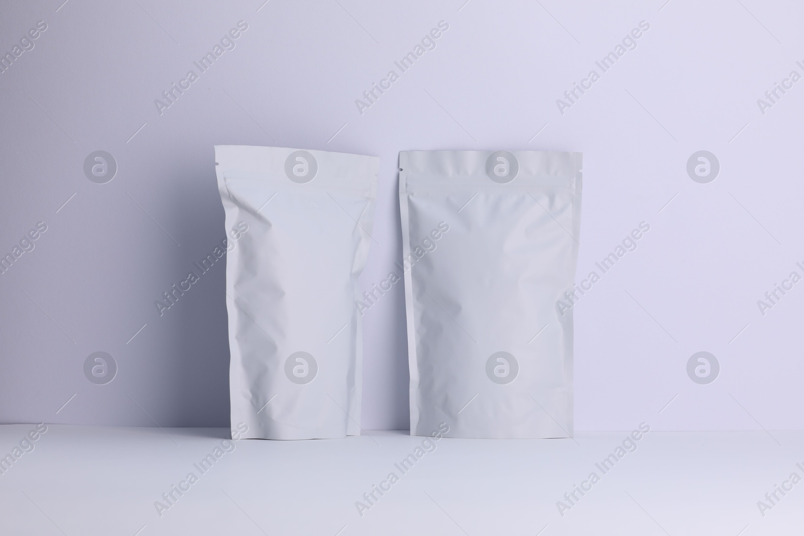 Zipper stand-up pouches on white background. Mockup for design Photo of Zipper stand-up pouches on white background. Mockup for design