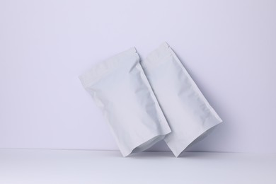 Photo of Zipper stand-up pouches on white background. Mockup for design