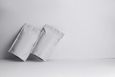 Photo of Zipper stand-up pouches on white background. Mockup for design