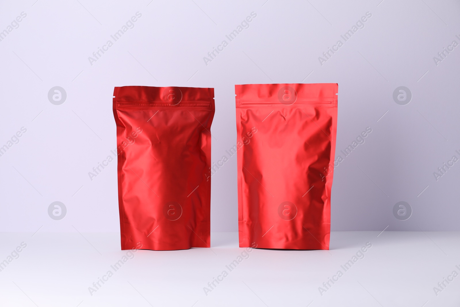Zipper stand-up pouches on white background. Mockup for design Photo of Zipper stand-up pouches on white background. Mockup for design