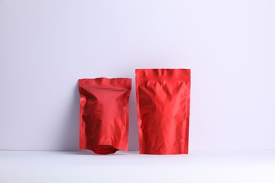 Photo of Zipper stand-up pouches on white background. Mockup for design