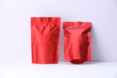 Photo of Zipper stand-up pouches on white background. Mockup for design