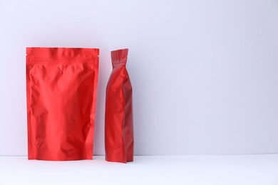 Photo of Zipper stand-up pouches on white background. Mockup for design