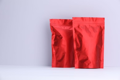 Photo of Zipper stand-up pouches on white background. Mockup for design