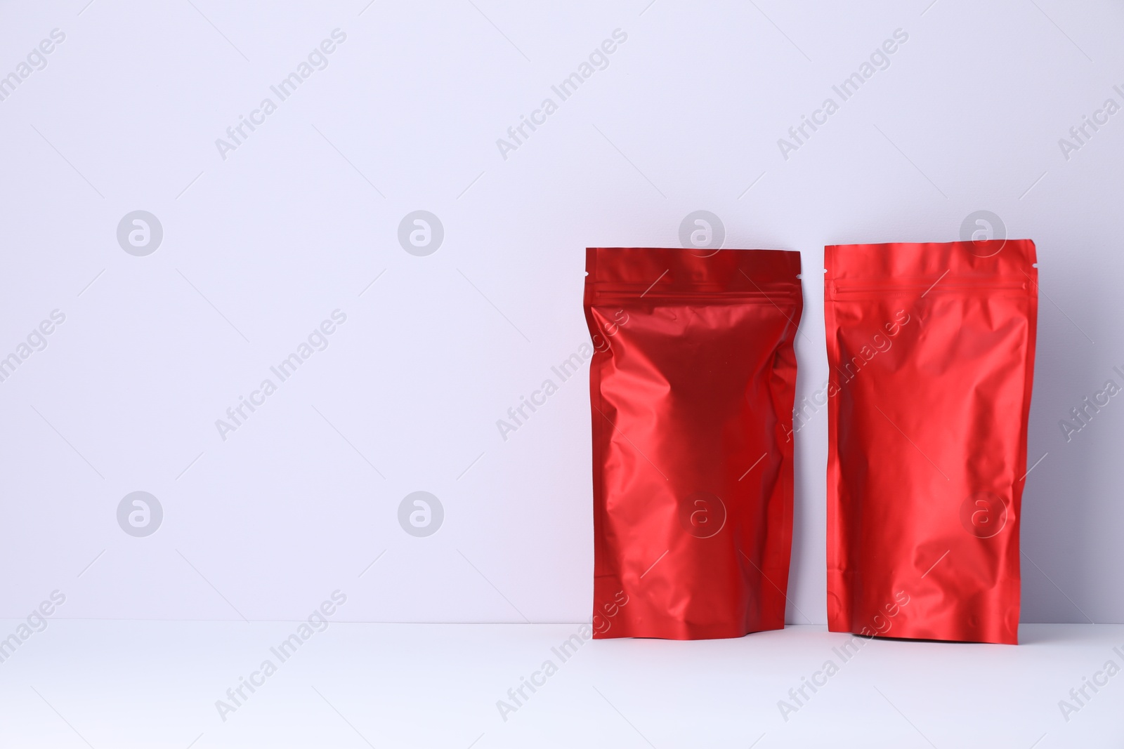 Zipper stand-up pouches on white background. Mockup for design Photo of Zipper stand-up pouches on white background. Mockup for design