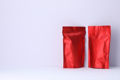 Photo of Zipper stand-up pouches on white background. Mockup for design