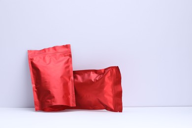 Photo of Zipper stand-up pouches on white background. Mockup for design
