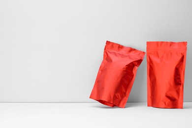 Photo of Zipper stand-up pouches on white background. Mockup for design