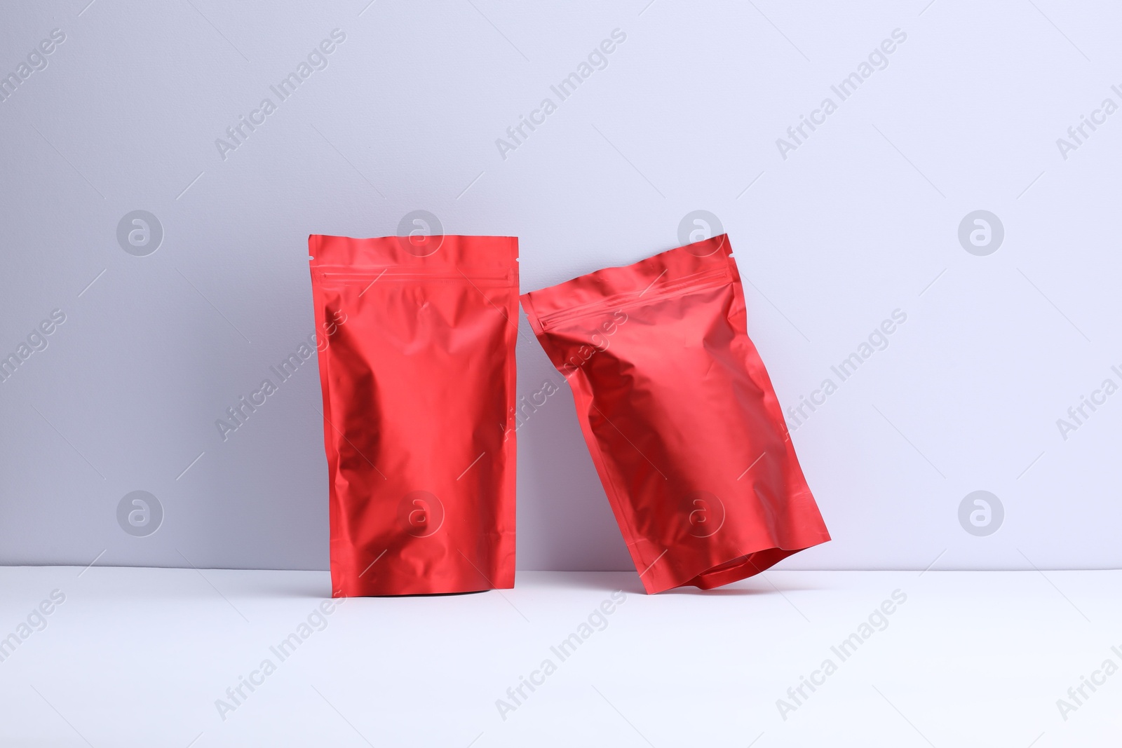 Zipper stand-up pouches on white background. Mockup for design Photo of Zipper stand-up pouches on white background. Mockup for design