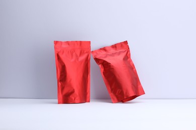 Photo of Zipper stand-up pouches on white background. Mockup for design