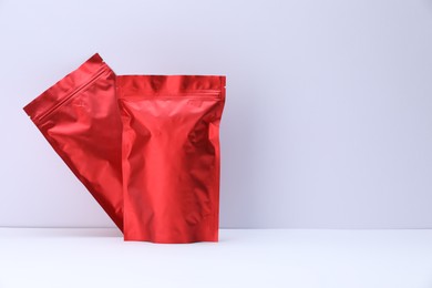 Photo of Zipper stand-up pouches on white background. Mockup for design