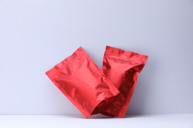 Photo of Zipper stand-up pouches on white background. Mockup for design