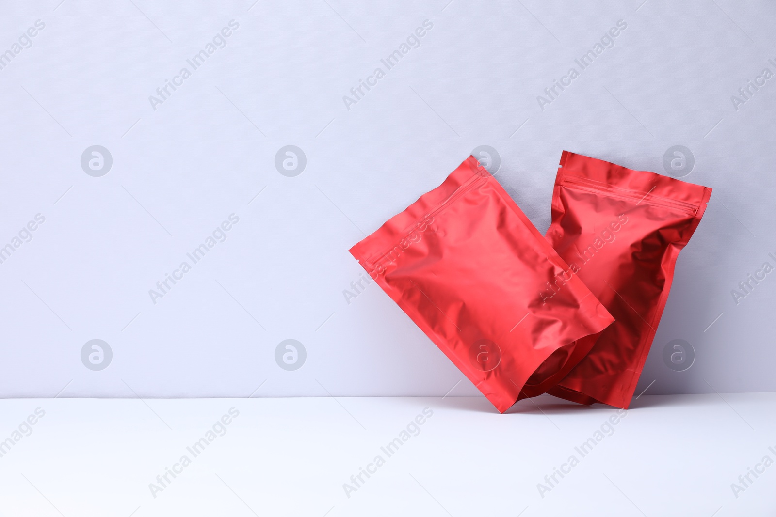 Zipper stand-up pouches on white background. Mockup for design Photo of Zipper stand-up pouches on white background. Mockup for design