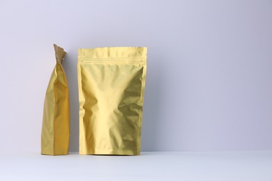 Photo of Zipper stand-up pouches on white background. Mockup for design