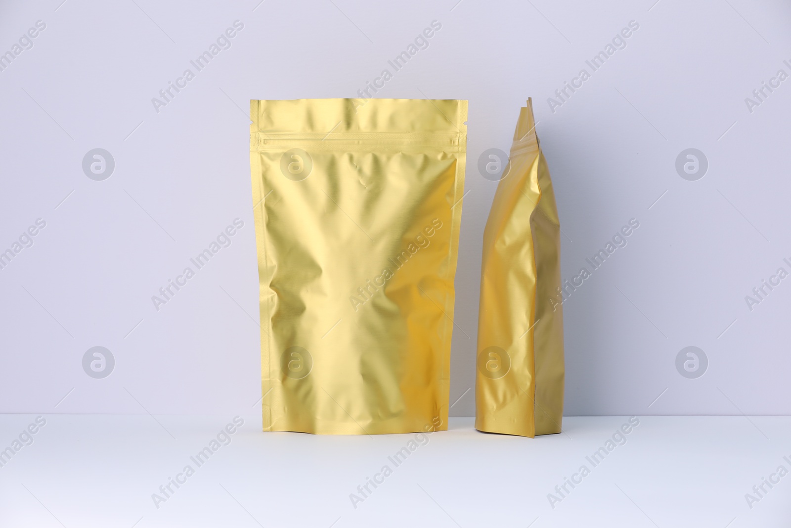 Zipper stand-up pouches on white background. Mockup for design Photo of Zipper stand-up pouches on white background. Mockup for design