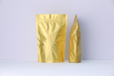 Photo of Zipper stand-up pouches on white background. Mockup for design