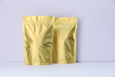 Photo of Zipper stand-up pouches on white background. Mockup for design