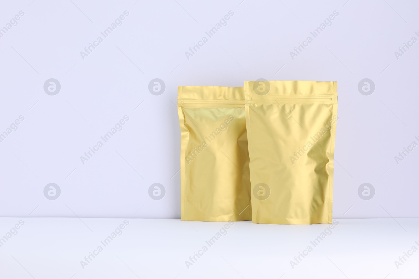 Zipper stand-up pouches on white background. Mockup for design Photo of Zipper stand-up pouches on white background. Mockup for design