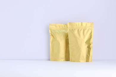 Photo of Zipper stand-up pouches on white background. Mockup for design