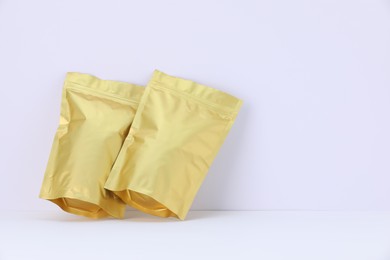 Photo of Zipper stand-up pouches on white background. Mockup for design