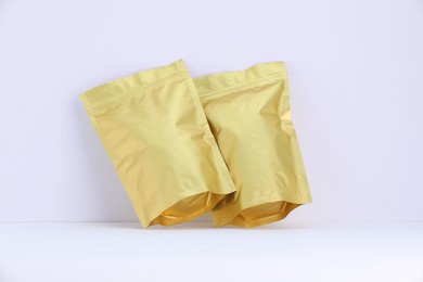 Photo of Zipper stand-up pouches on white background. Mockup for design