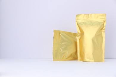 Photo of Zipper stand-up pouches on white background. Mockup for design