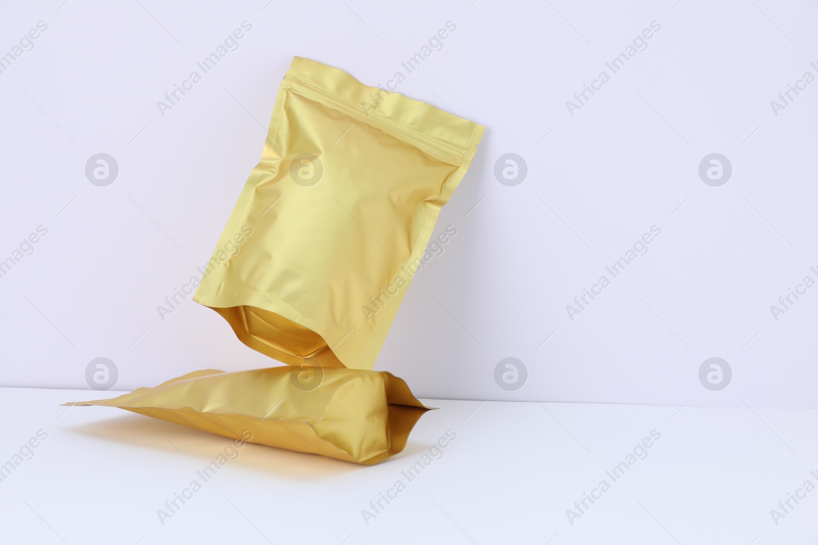 Zipper stand-up pouches on white background. Mockup for design Photo of Zipper stand-up pouches on white background. Mockup for design