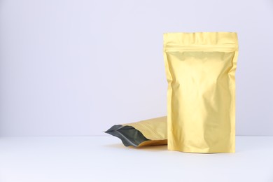 Photo of Zipper stand-up pouches on white background. Mockup for design