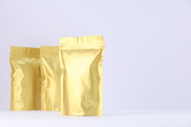 Photo of Zipper stand-up pouches on white background. Mockup for design