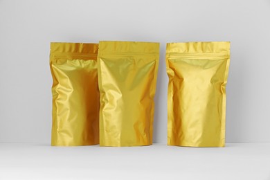 Photo of Zipper stand-up pouches on white background. Mockup for design
