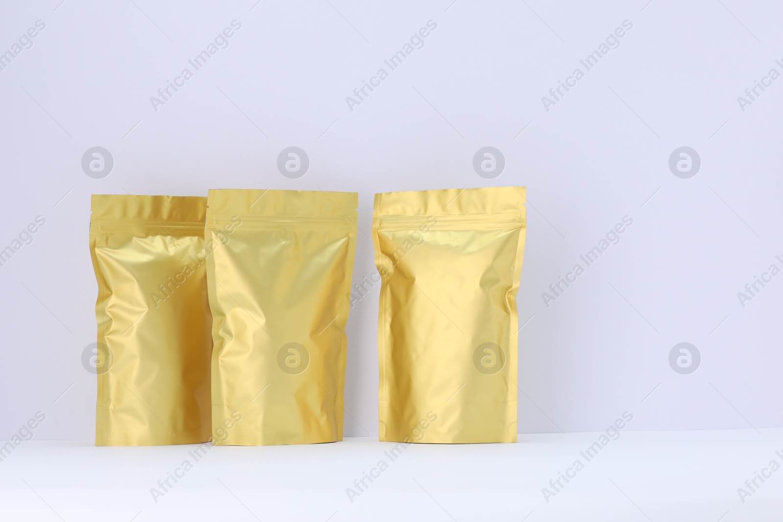 Zipper stand-up pouches on white background. Mockup for design Photo of Zipper stand-up pouches on white background. Mockup for design