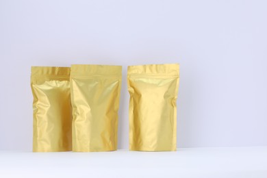 Photo of Zipper stand-up pouches on white background. Mockup for design