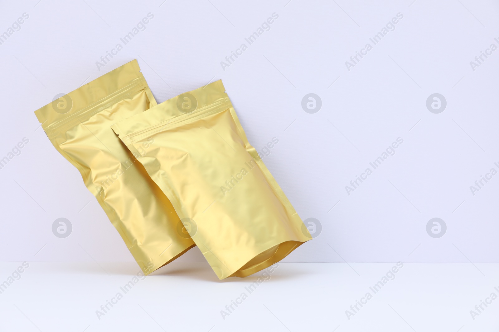 Zipper stand-up pouches on white background. Mockup for design Photo of Zipper stand-up pouches on white background. Mockup for design