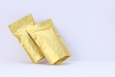 Photo of Zipper stand-up pouches on white background. Mockup for design