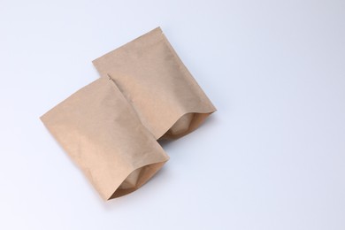 Photo of Zipper stand-up pouches on white background. Mockup for design