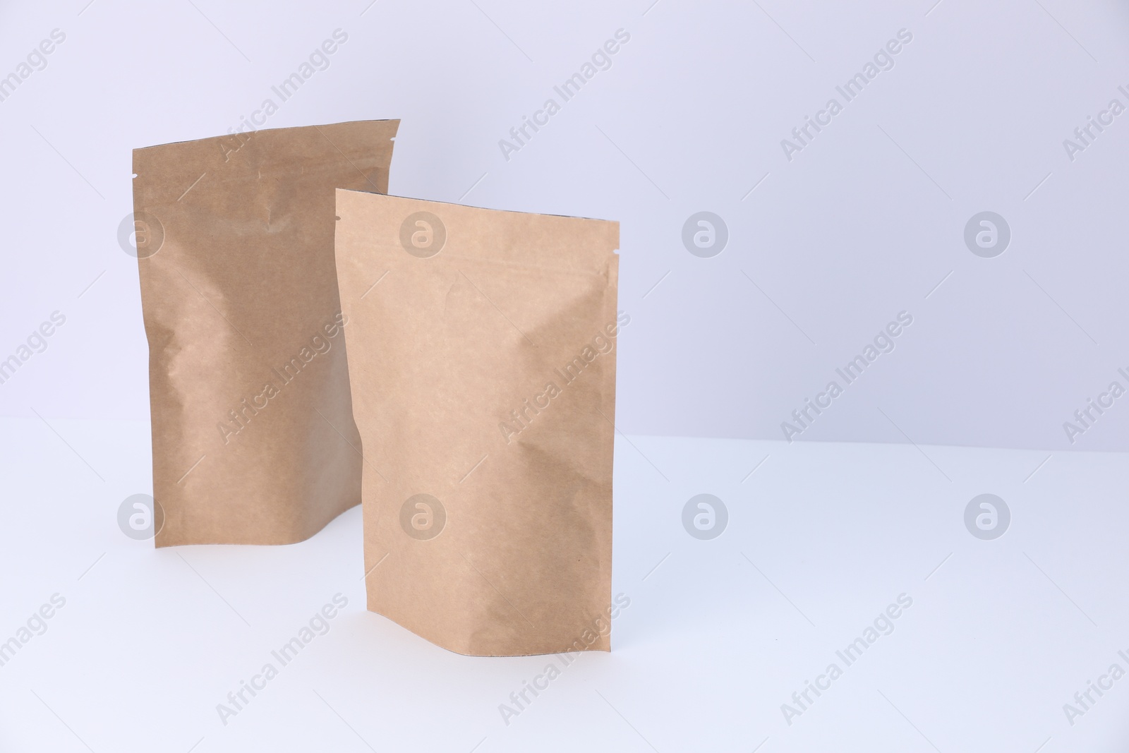 Zipper stand-up pouches on white background. Mockup for design Photo of Zipper stand-up pouches on white background. Mockup for design