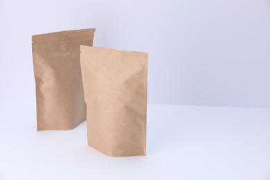 Photo of Zipper stand-up pouches on white background. Mockup for design