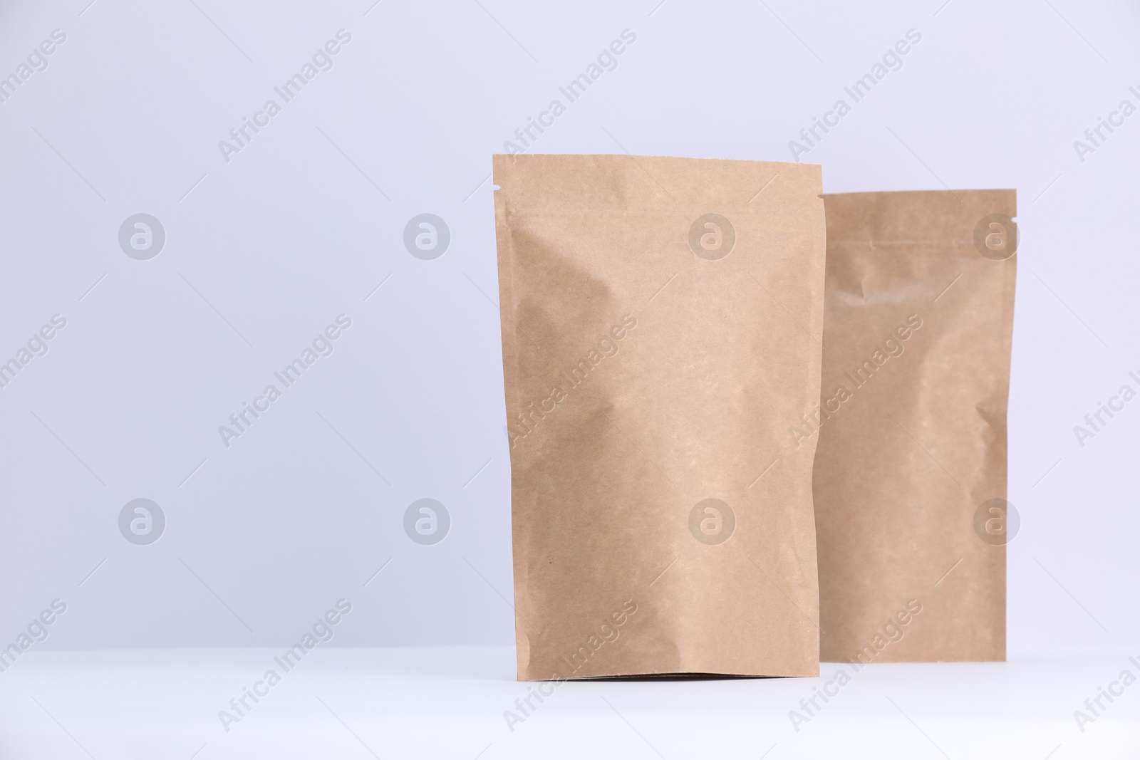 Zipper stand-up pouches on white background. Mockup for design Photo of Zipper stand-up pouches on white background. Mockup for design