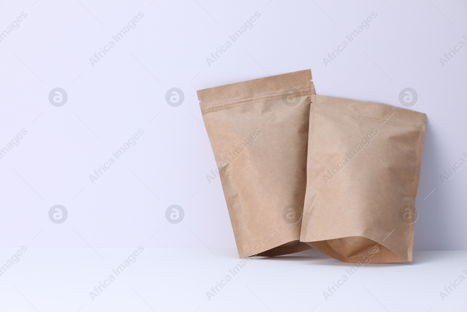 Zipper stand-up pouches on white background. Mockup for design Photo of Zipper stand-up pouches on white background. Mockup for design