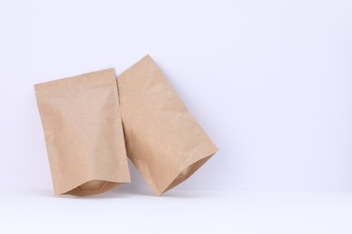 Photo of Zipper stand-up pouches on white background. Mockup for design